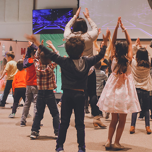 Children worshiping together at First Colony Church of Christ in Sugar Land, Texas, praising God and growing in faith through Children's Ministry.